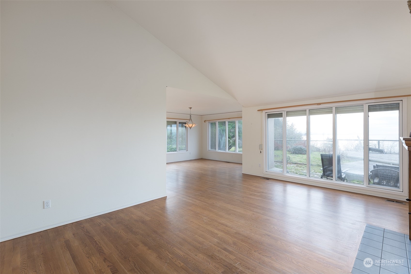 193 Mariners Point Road Sequim, WA 98382 - Photo 5 of 36 wooden floor in an empty room with a window