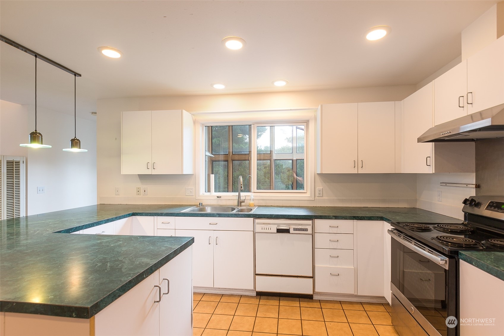 193 Mariners Point Road Sequim, WA 98382 - Photo 6 of 36 a kitchen with stainless steel appliances granite countertop a sink stove and cabinets