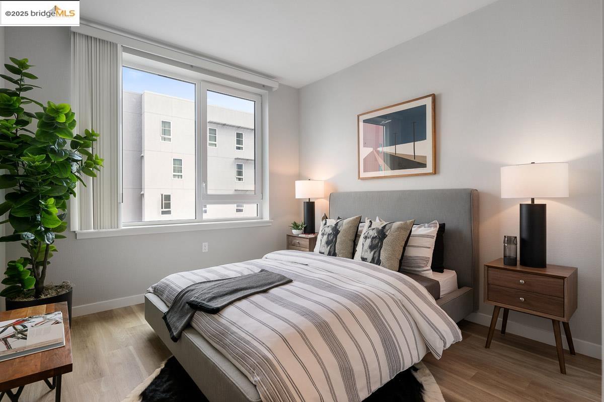 260 Brooklyn Basin Way, Unit 428 Oakland, CA 94606 - Photo 15 of 44 Bedroom featuring light wood-type flooring and baseboards