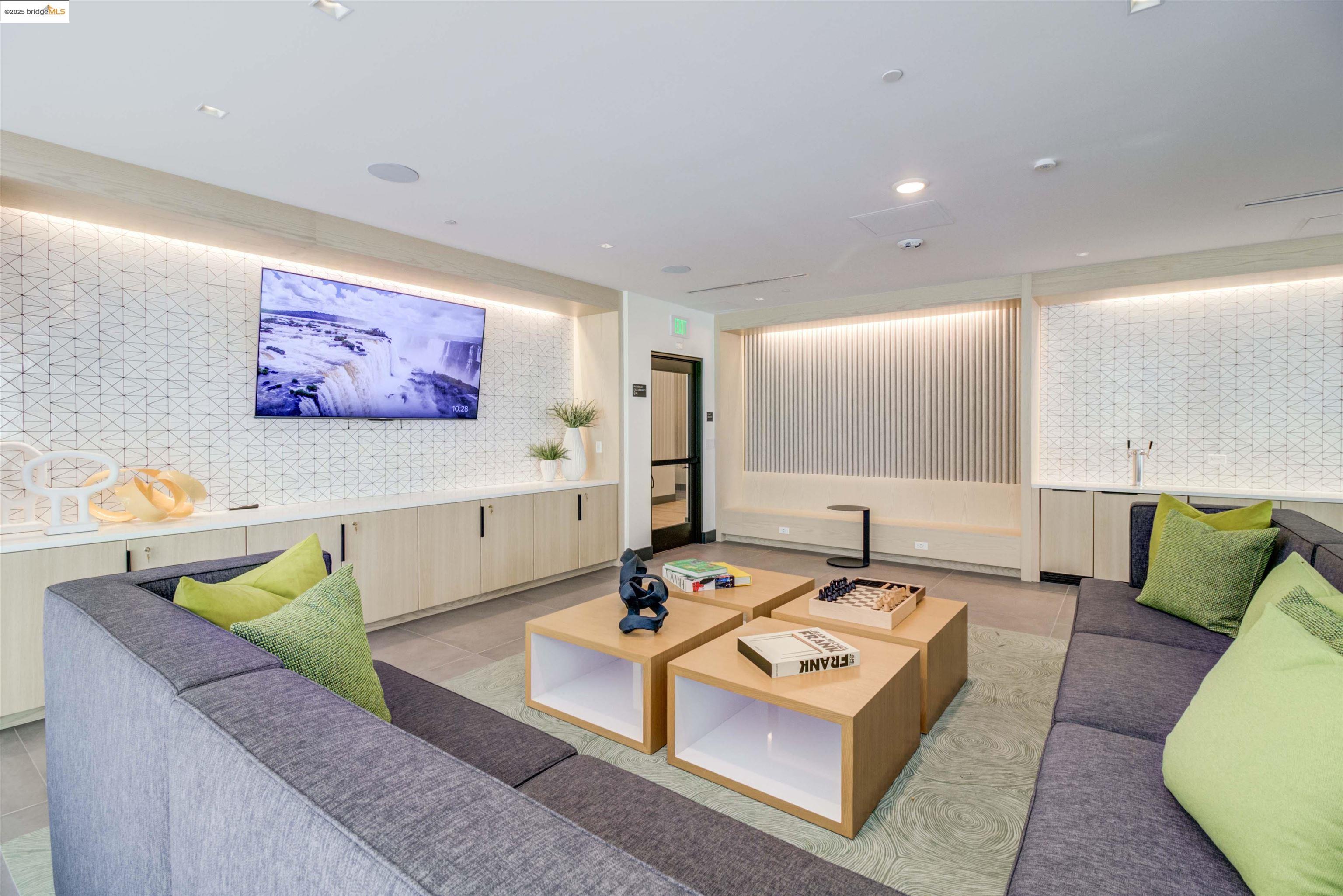 260 Brooklyn Basin Way, Unit 428 Oakland, CA 94606 - Photo 30 of 44 Living area with wallpapered walls, light tile patterned floors, and recessed lighting