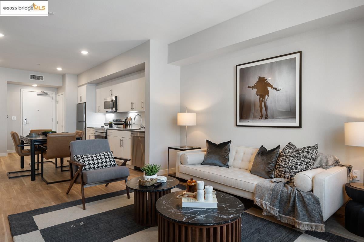 260 Brooklyn Basin Way, Unit 428 Oakland, CA 94606 - Photo 3 of 44 Living room featuring light wood-style floors and recessed lighting