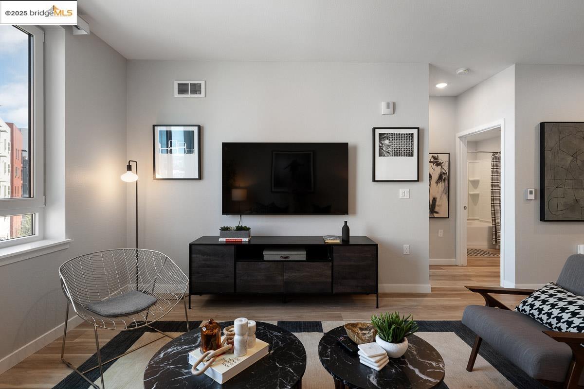 260 Brooklyn Basin Way, Unit 428 Oakland, CA 94606 - Photo 5 of 44 Living area with wood finished floors