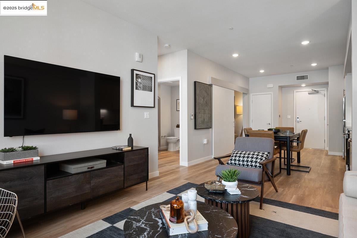 260 Brooklyn Basin Way, Unit 428 Oakland, CA 94606 - Photo 6 of 44 Living room featuring light wood-type flooring and recessed lighting