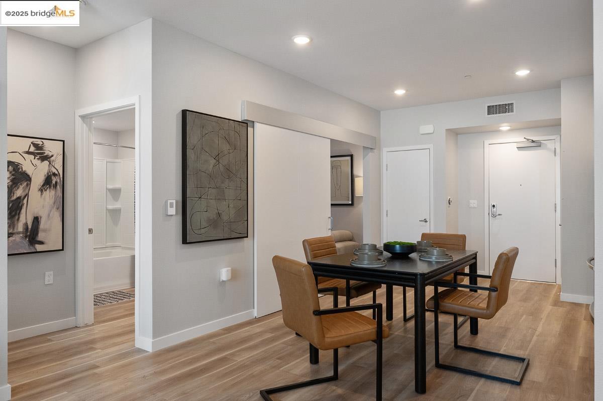 260 Brooklyn Basin Way, Unit 428 Oakland, CA 94606 - Photo 9 of 44 Dining room with light wood finished floors and recessed lighting