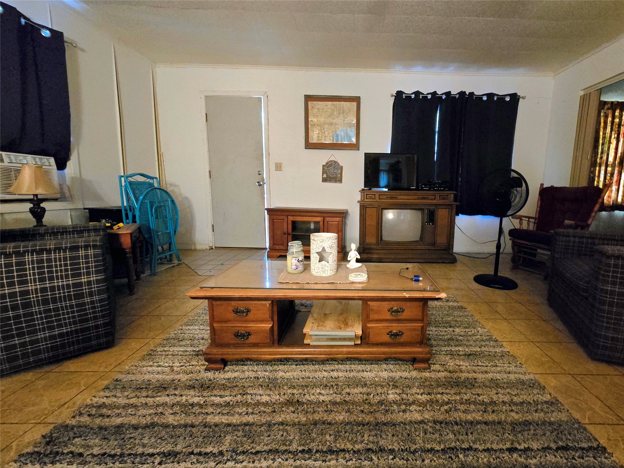 81 Bishop Street Point Blank, TX 77364 - Photo 13 of 22 a living room with furniture a fireplace and a flat screen tv