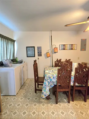 a living room with furniture a window and a table