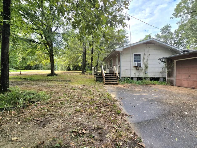 a house with trees in the background