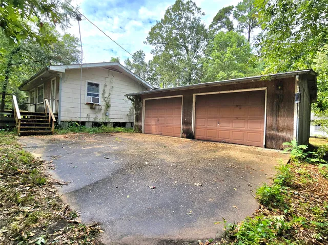 a house with trees in the background