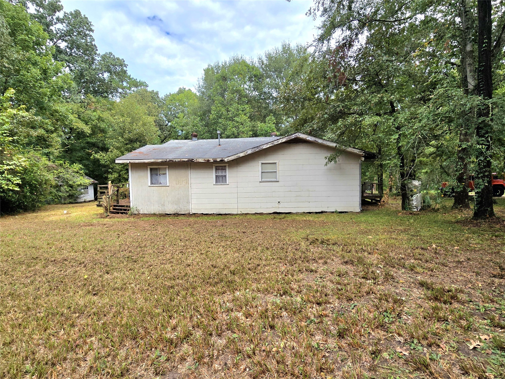 81 Bishop Street Point Blank, TX 77364 - Photo 7 of 22 a house view with a garden space