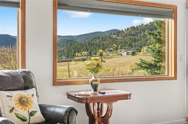 a living room with furniture and window