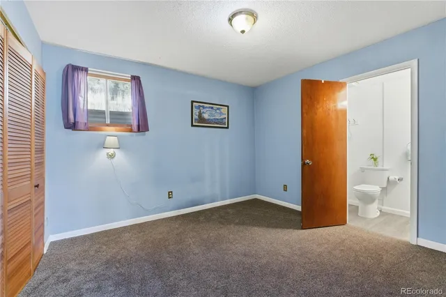 a bathroom with a sink a toilet and vanity