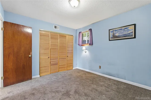 a bathroom with a shower curtain and a sink