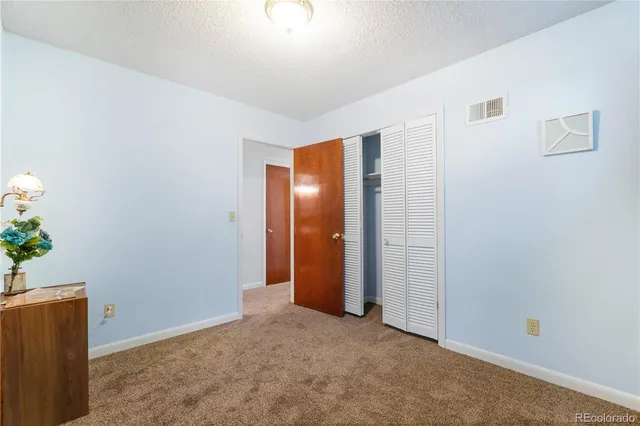 an empty room with an entrance to other room