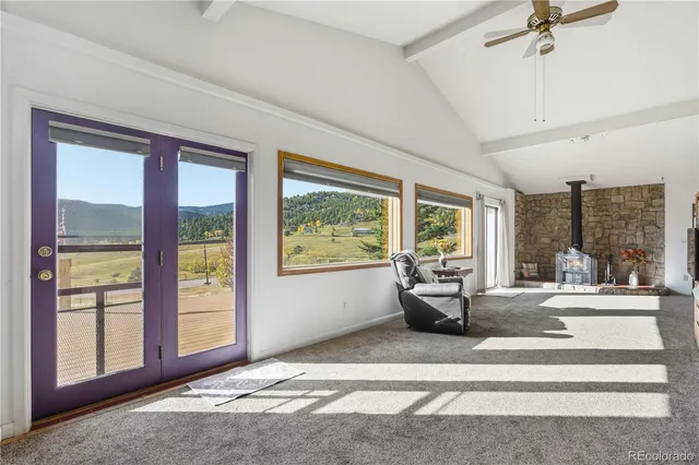 a view of a big room with windows and cabinet