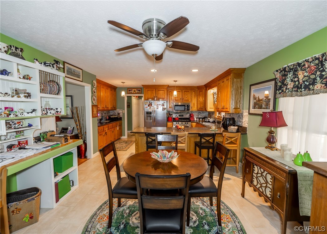 175 Walton Road Keysville, VA 23947 - Photo 27 of 49 a view of a dining room with furniture and a kitchen