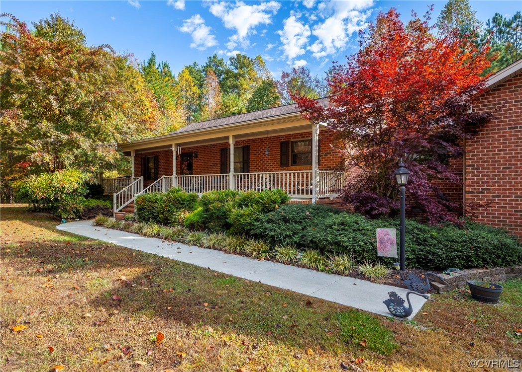 175 Walton Road Keysville, VA 23947 - Photo 3 of 49 a front view of a house with garden