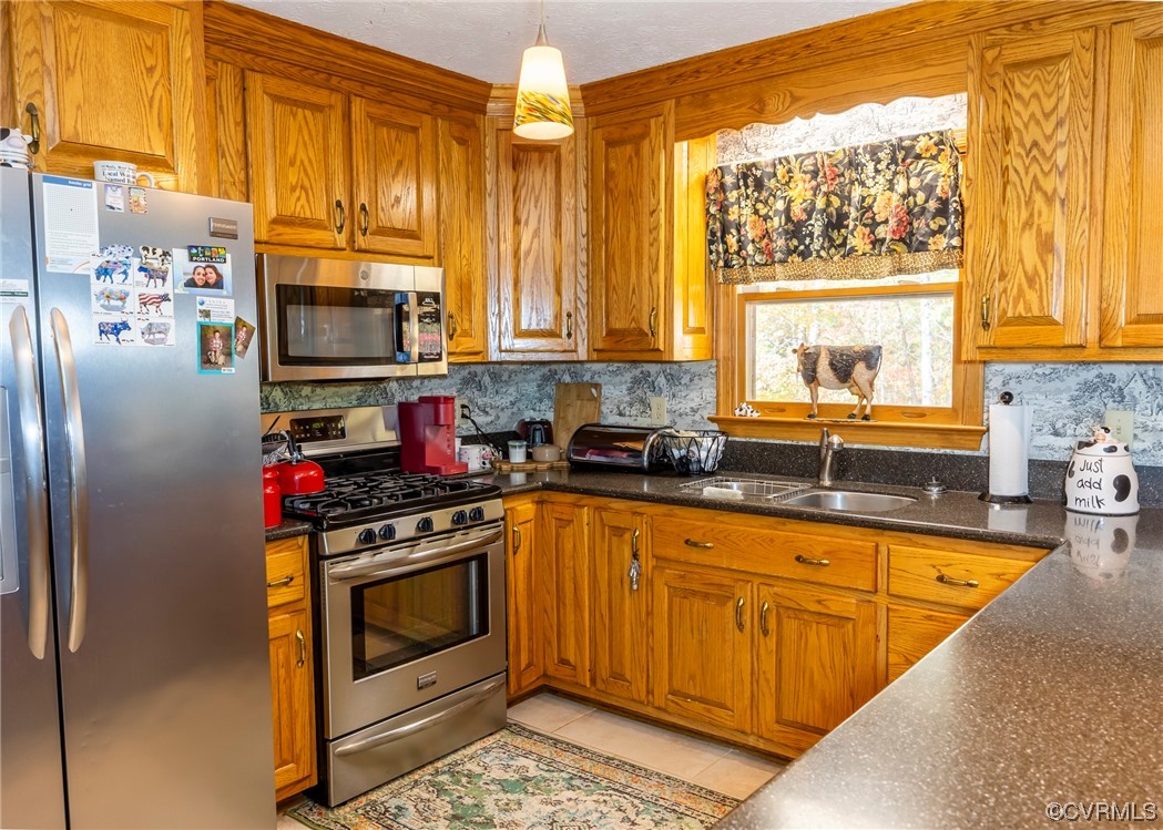 175 Walton Road Keysville, VA 23947 - Photo 34 of 49 a kitchen with stainless steel appliances granite countertop a stove a sink and a refrigerator