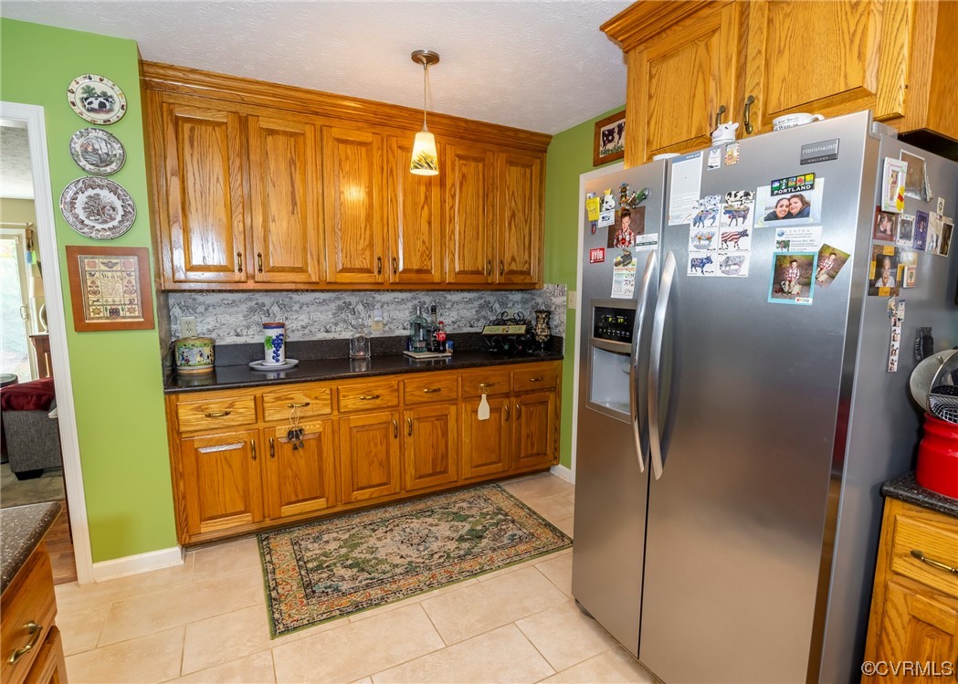 175 Walton Road Keysville, VA 23947 - Photo 35 of 49 a kitchen with stainless steel appliances granite countertop a refrigerator and a stove