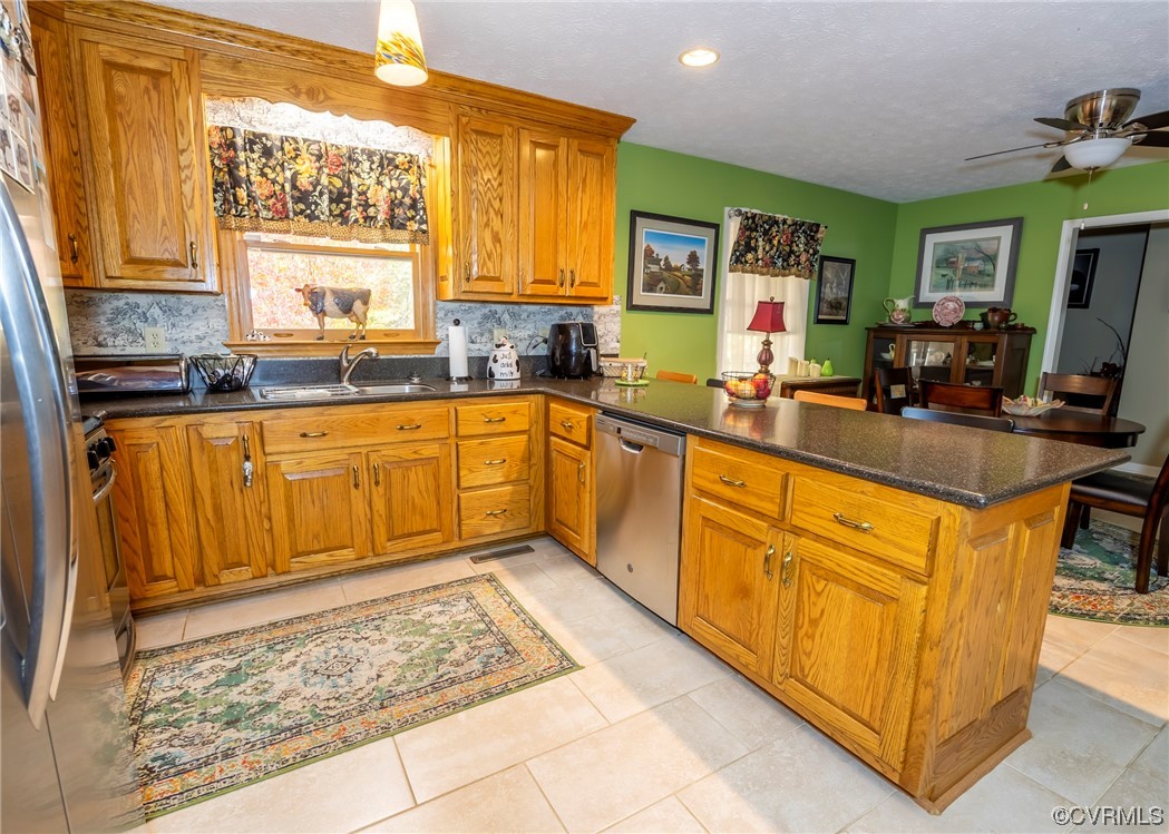 175 Walton Road Keysville, VA 23947 - Photo 36 of 49 a kitchen with stainless steel appliances granite countertop sink stove and refrigerator