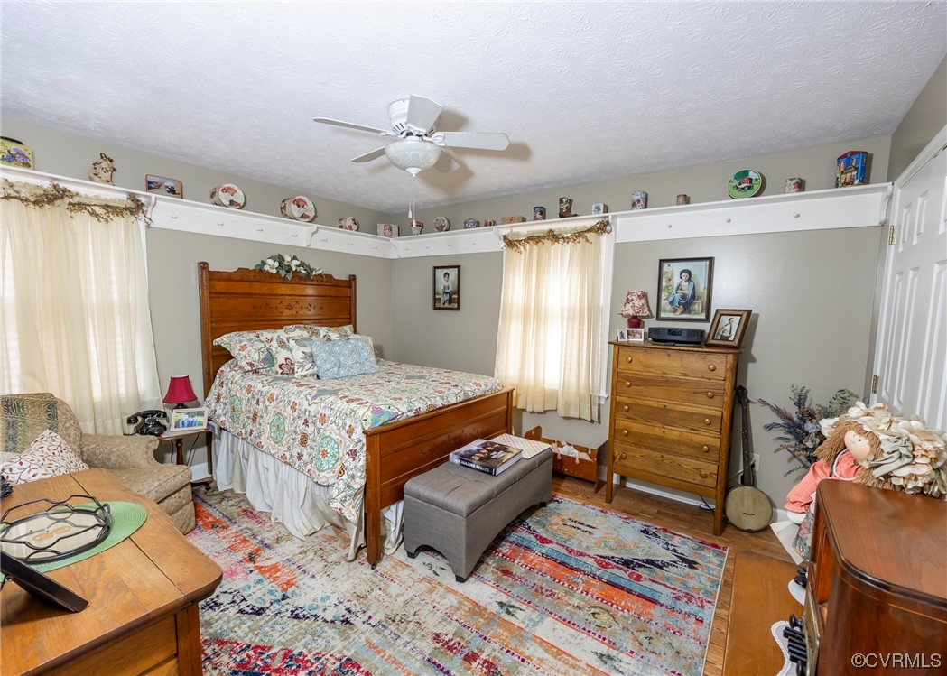 175 Walton Road Keysville, VA 23947 - Photo 37 of 49 a bedroom with a bed and wooden floor