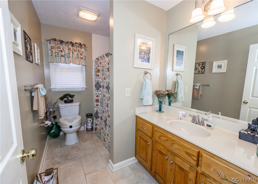 175 Walton Road Keysville, VA 23947 - Photo 39 of 49 a bathroom with a sink double vanity and toilet