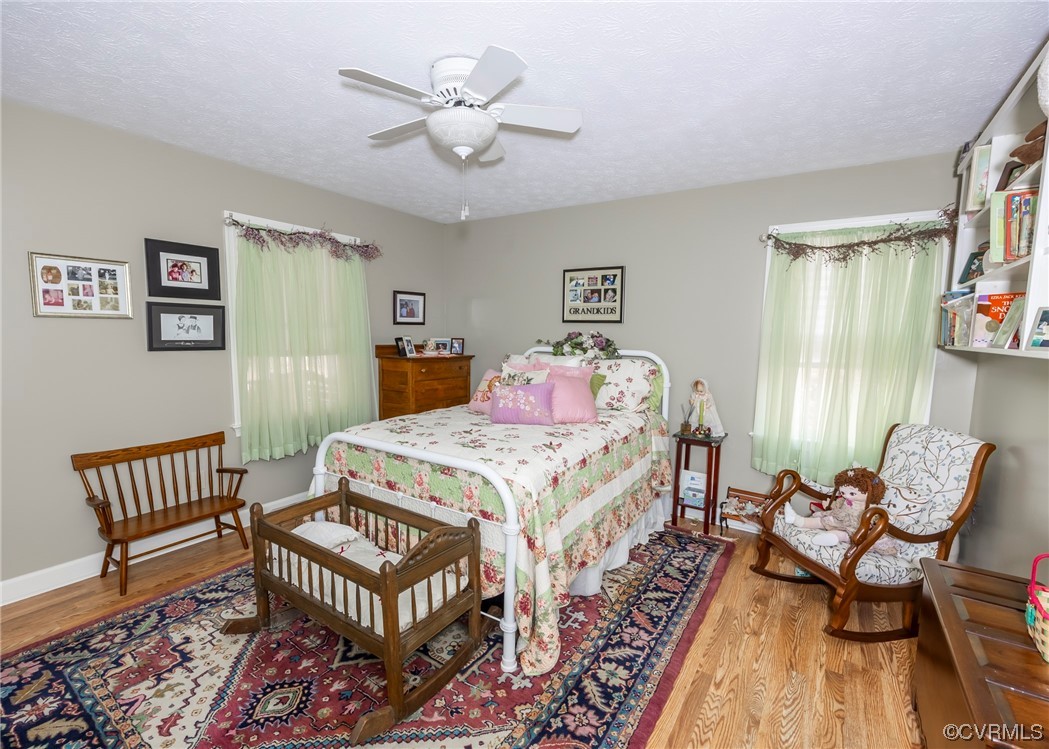 175 Walton Road Keysville, VA 23947 - Photo 41 of 49 a bedroom with a bed and a table in it
