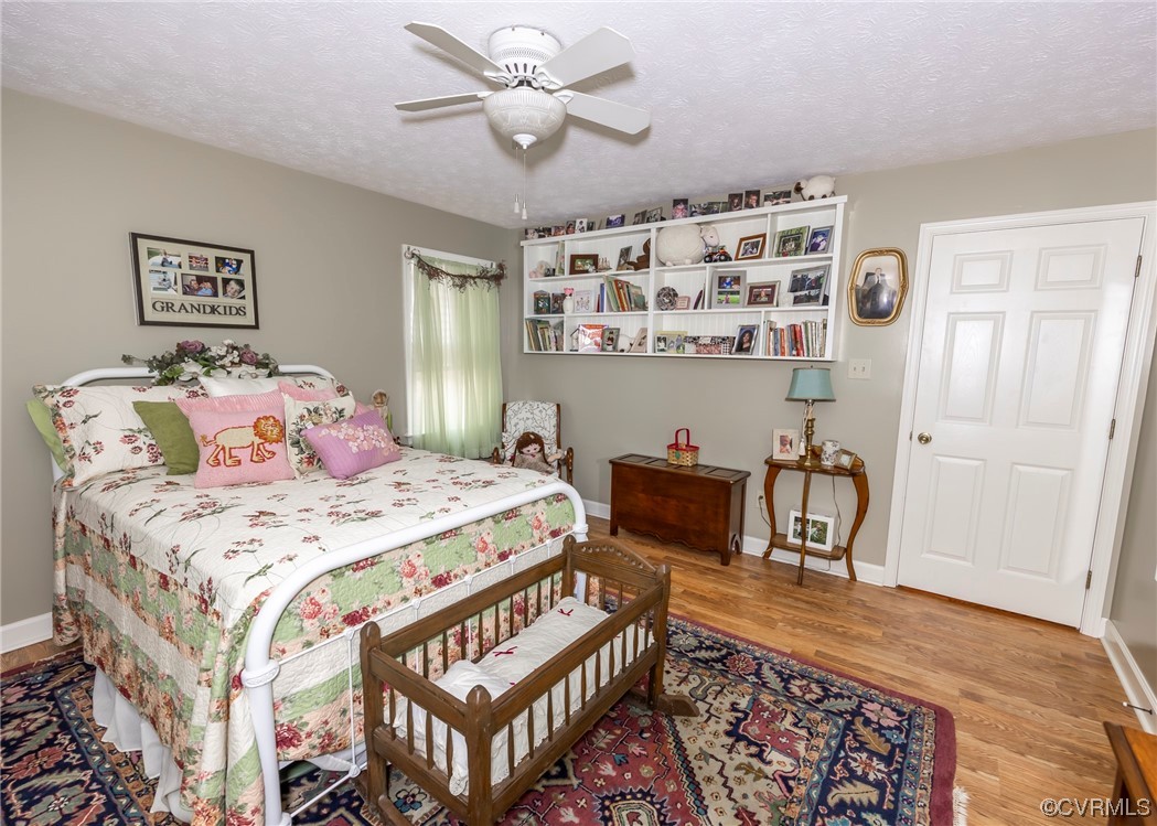 175 Walton Road Keysville, VA 23947 - Photo 42 of 49 a bedroom with a bed a table and chair