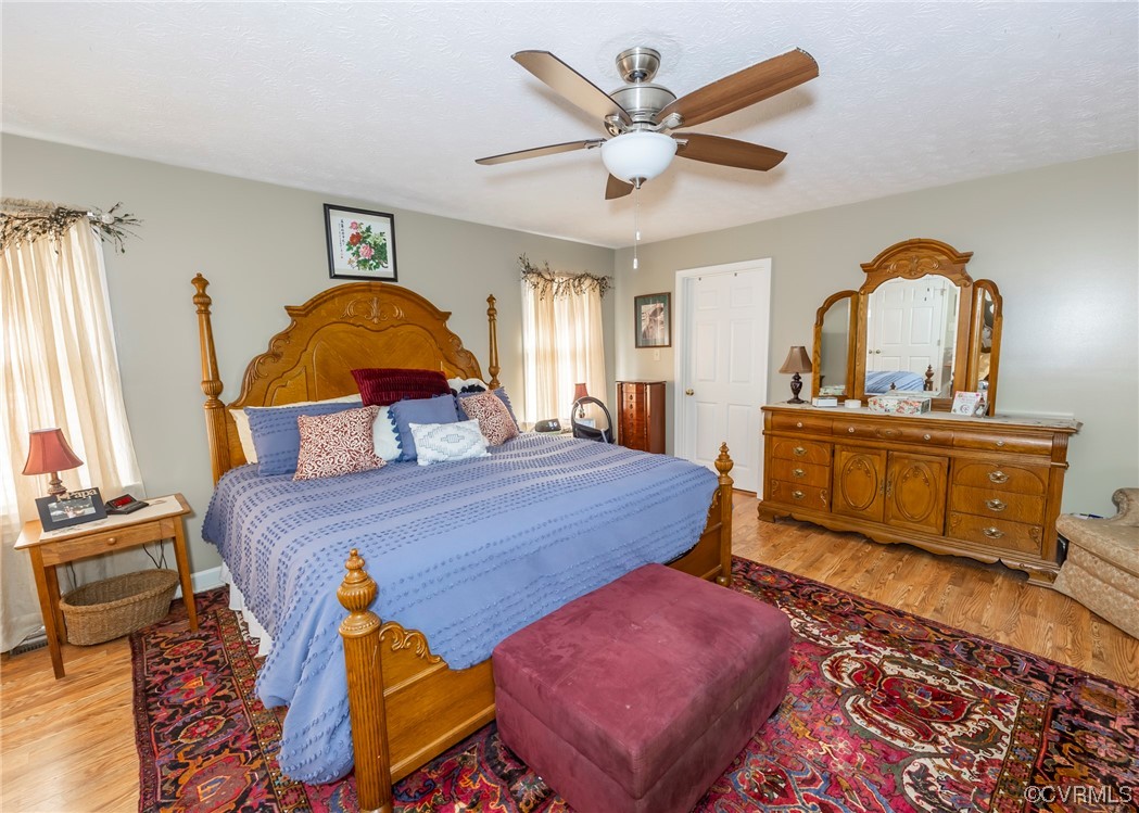 175 Walton Road Keysville, VA 23947 - Photo 45 of 49 a bedroom with a bed and wooden floor