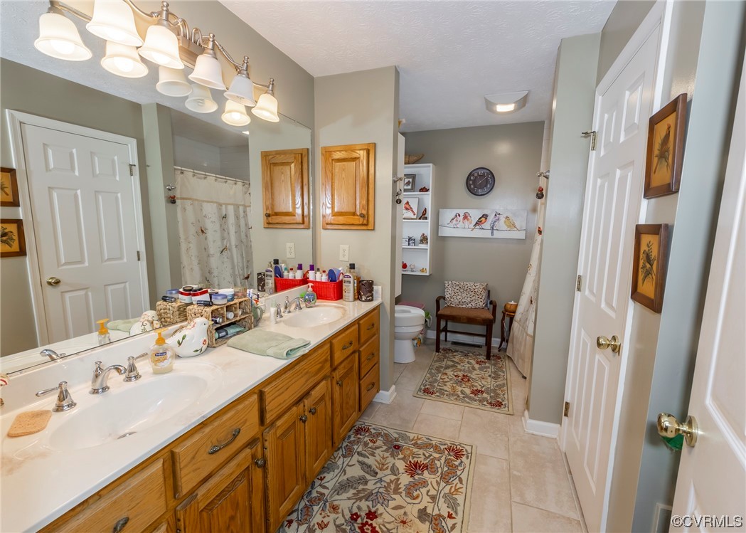 175 Walton Road Keysville, VA 23947 - Photo 47 of 49 a bathroom with a sink double vanity and a mirror