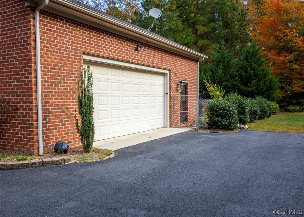 175 Walton Road Keysville, VA 23947 - Photo 8 of 49 a front view of a house with a yard and garage