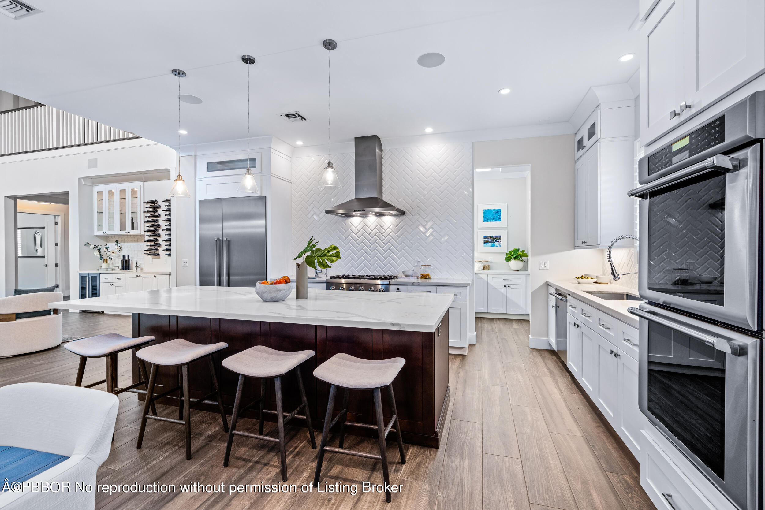234 Desota Road West Palm Beach, FL 33405 - Photo 13 of 36 a kitchen with stainless steel appliances granite countertop a kitchen island hardwood floor sink stove dining table and chairs