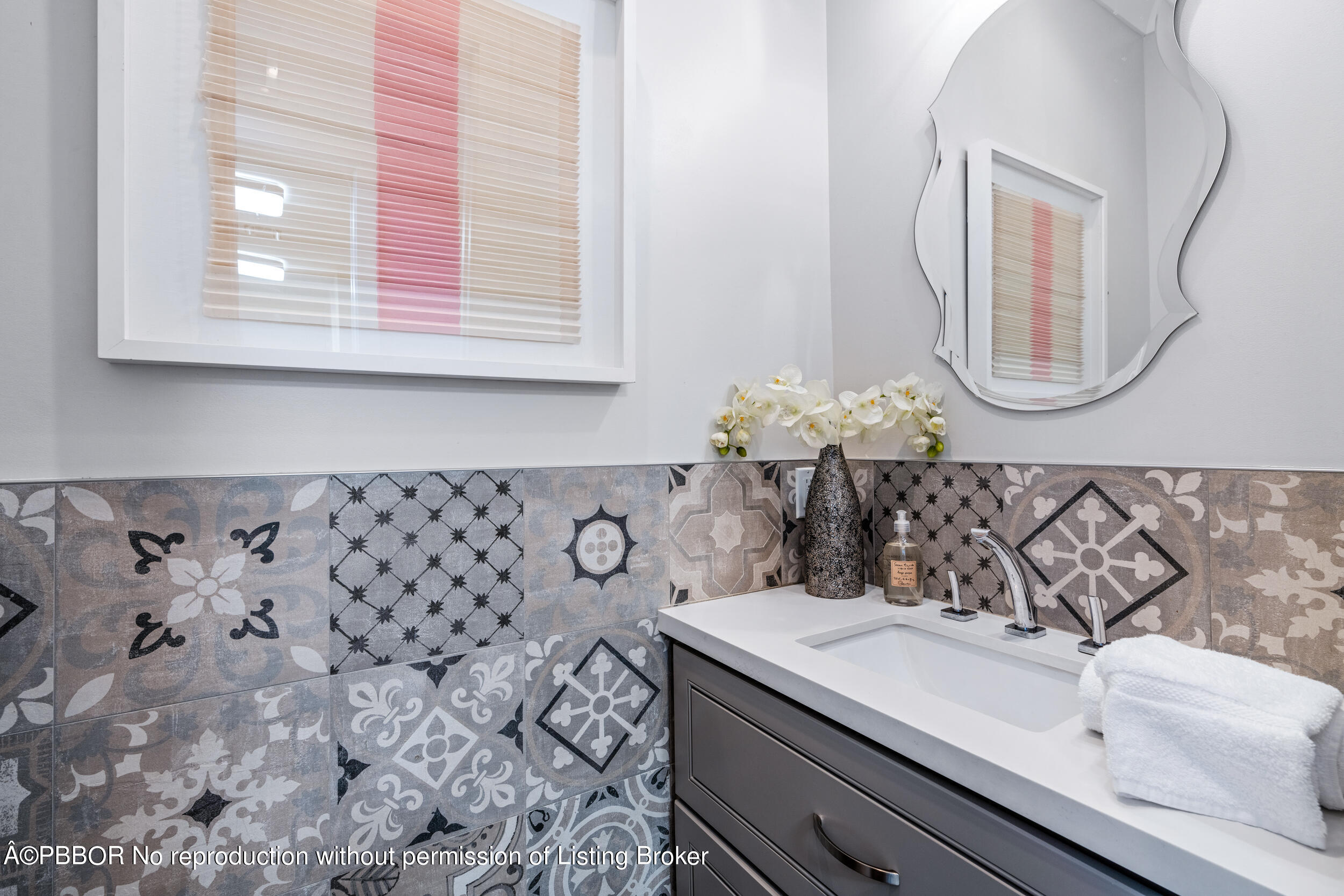 234 Desota Road West Palm Beach, FL 33405 - Photo 28 of 36 a bathroom with a sink and a mirror