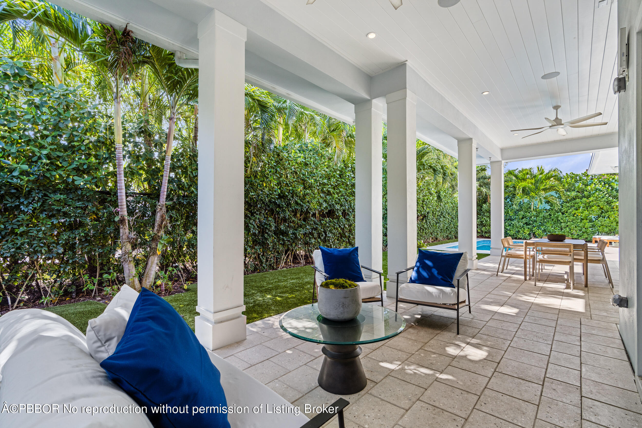234 Desota Road West Palm Beach, FL 33405 - Photo 30 of 36 a living room with patio furniture and floor to ceiling windows