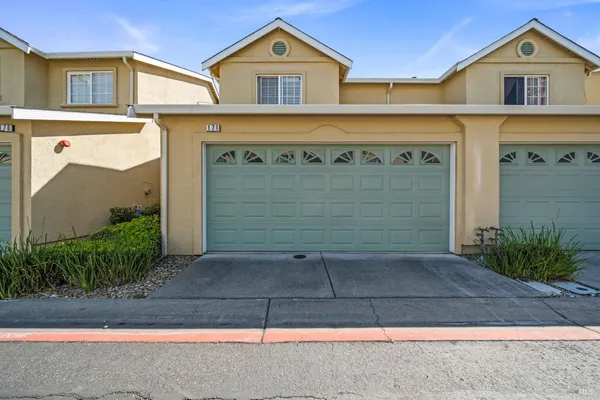 a front view of a house with garage