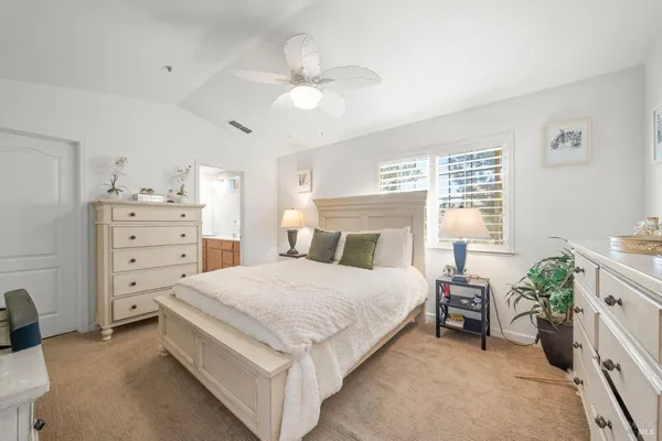 a bedroom with a bed and a cabinets