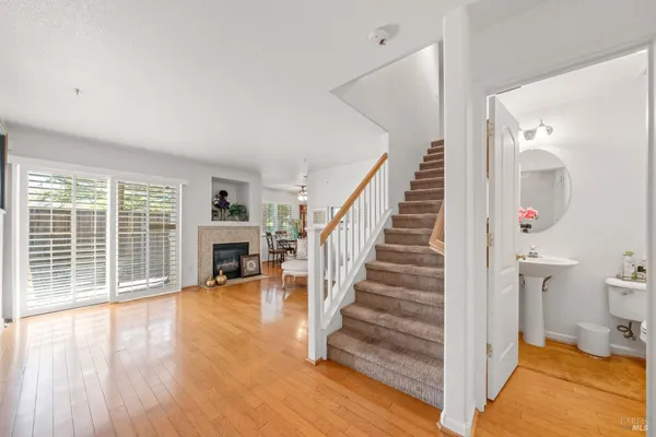 a view of entryway and hall with wooden floor