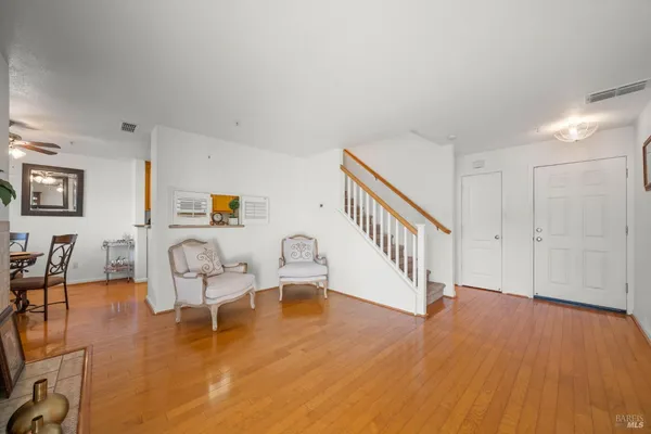 a view of livingroom with furniture and wooden floor