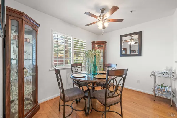 a view of a dining room with furniture window and wooden floor