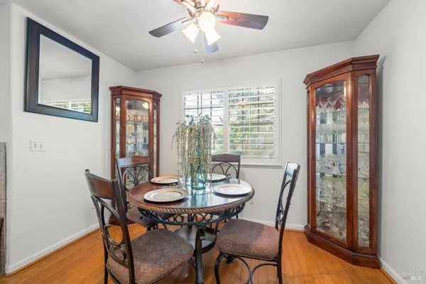 a view of a dining room with furniture window and wooden floor