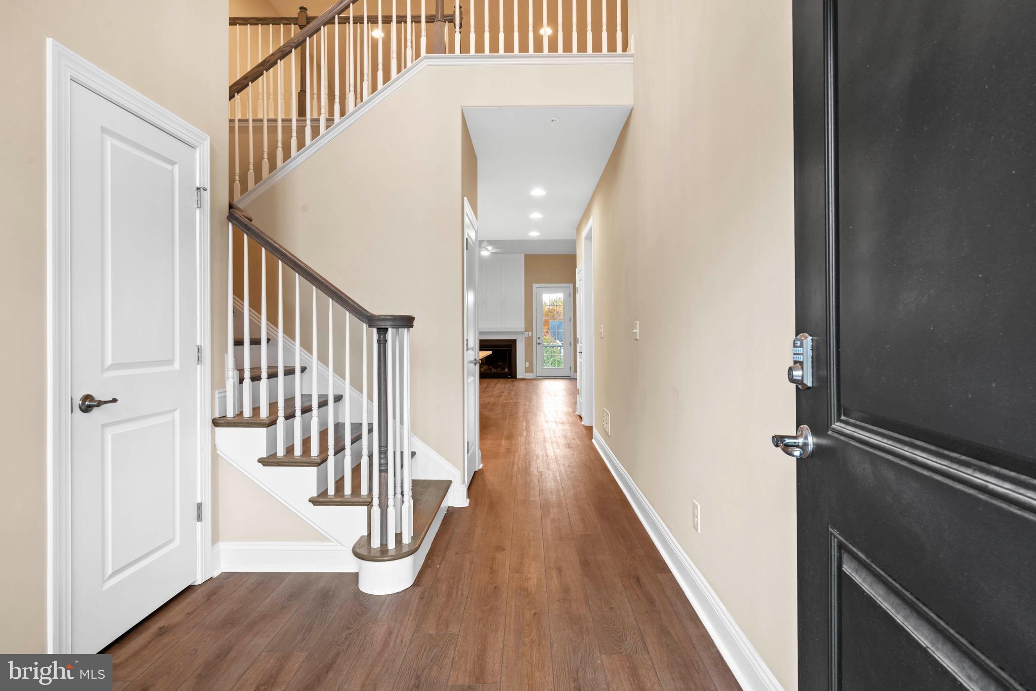 513 Valley Road Newark, DE 19711 - Photo 7 of 55 Foyer with turned staircase and Luxury Vinyl