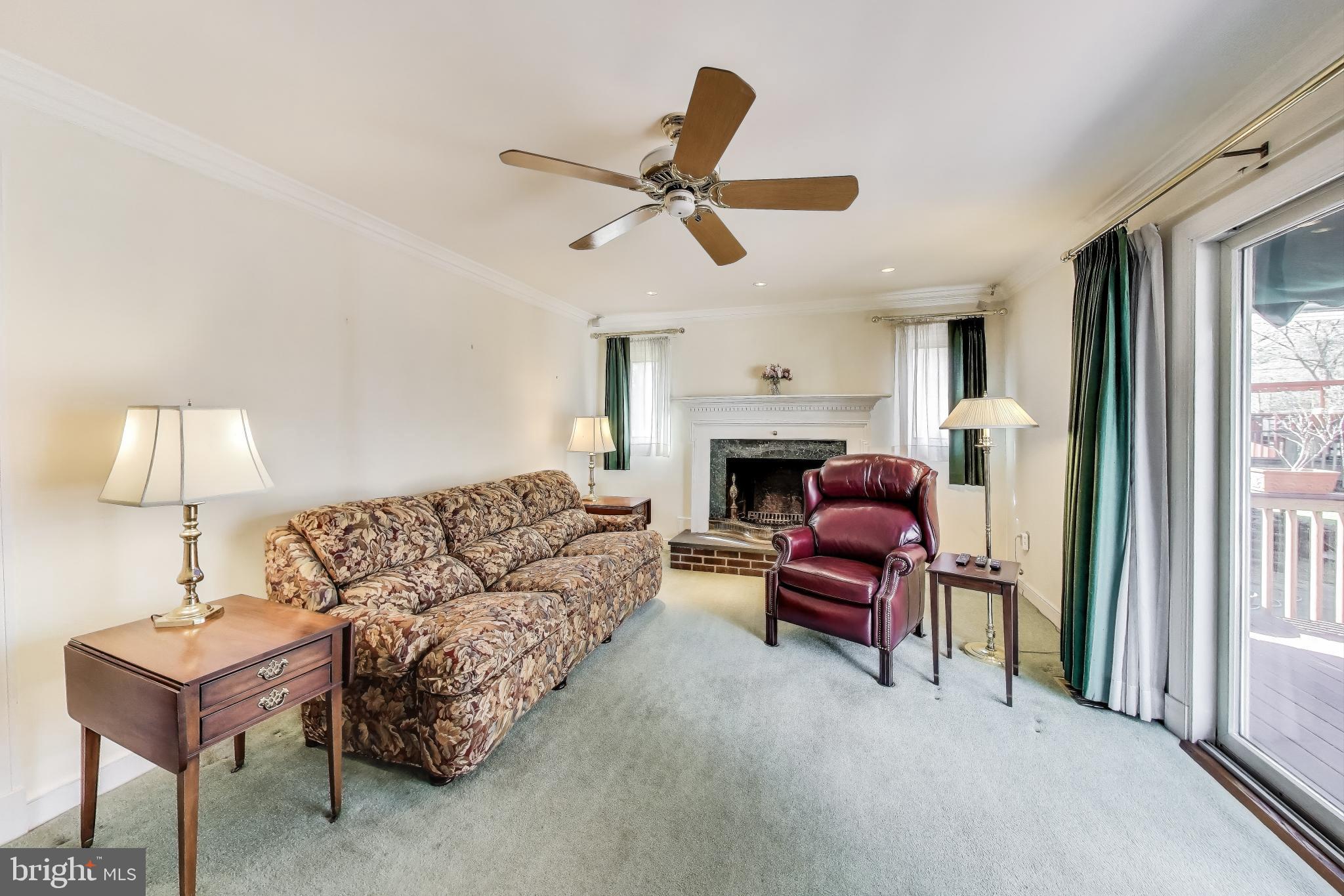 9201 Centerway Road Gaithersburg, MD 20879 - Photo 12 of 53 a living room with furniture and a window