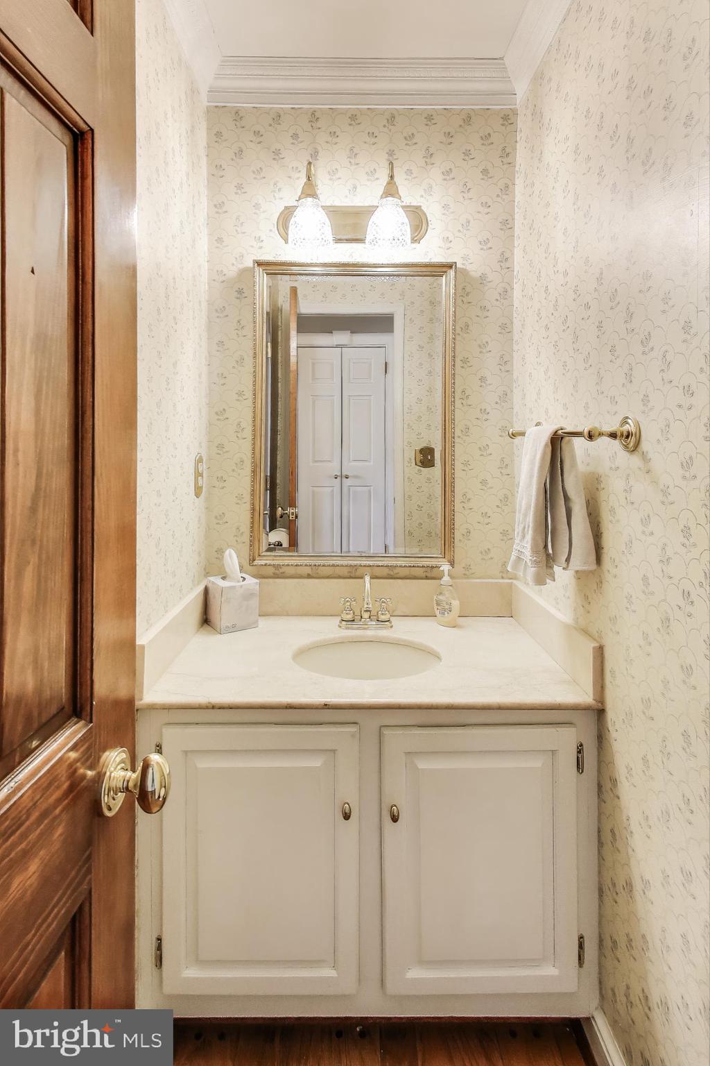 9201 Centerway Road Gaithersburg, MD 20879 - Photo 15 of 53 a bathroom with a sink vanity and mirror