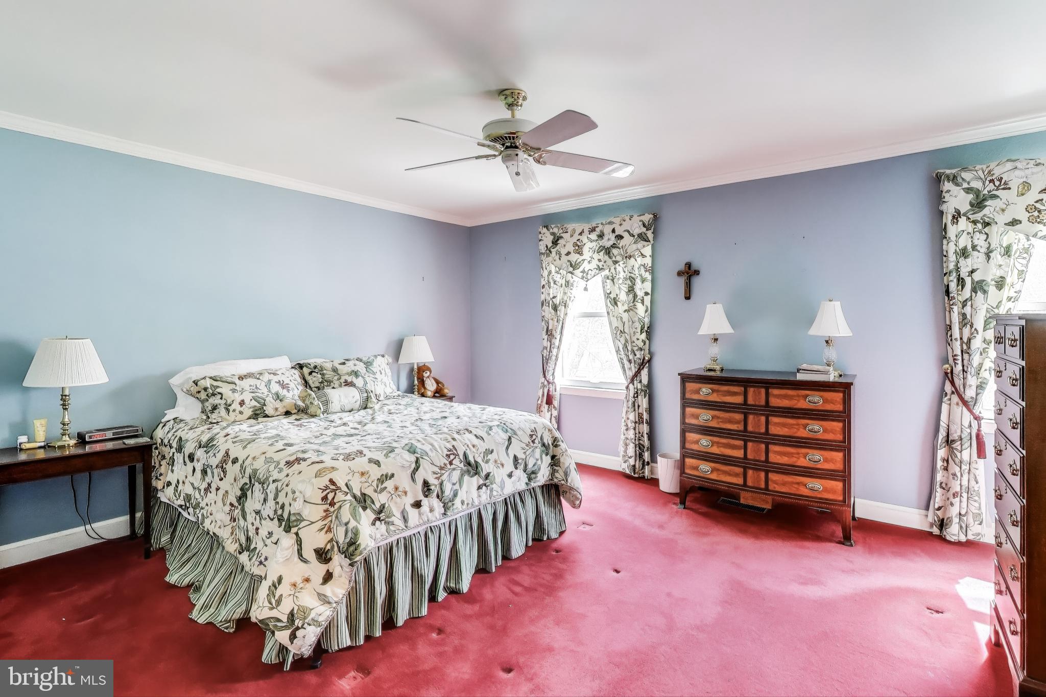 9201 Centerway Road Gaithersburg, MD 20879 - Photo 16 of 53 a bedroom with a bed and a chandelier