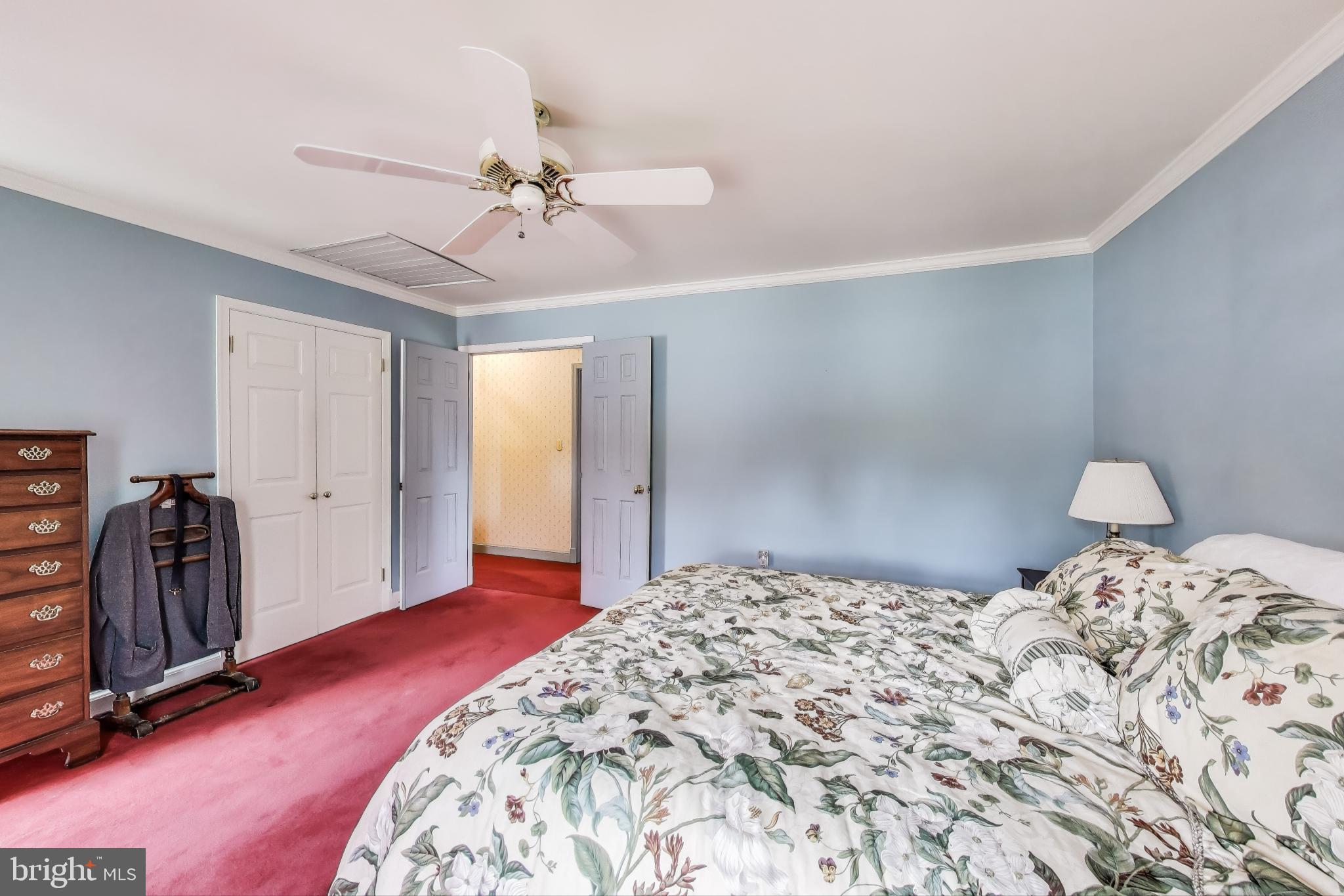 9201 Centerway Road Gaithersburg, MD 20879 - Photo 18 of 53 a bedroom with a bed and a walk in closet