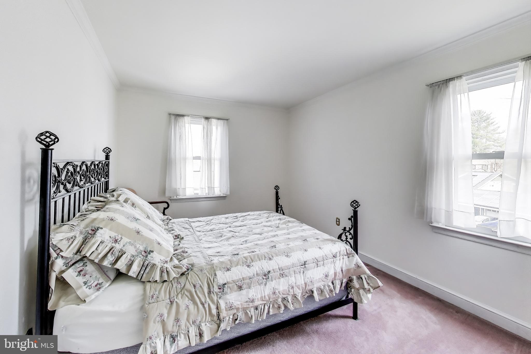 9201 Centerway Road Gaithersburg, MD 20879 - Photo 20 of 53 a bedroom with a bed and a window