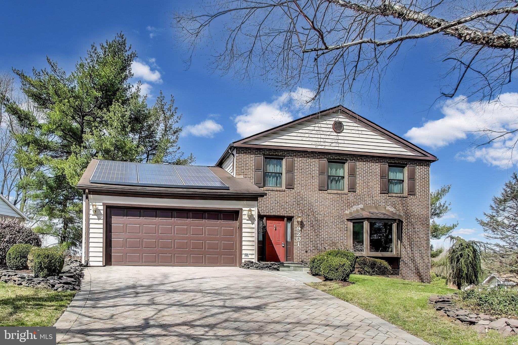 9201 Centerway Road Gaithersburg, MD 20879 - Photo 2 of 53 a front view of a house with garden