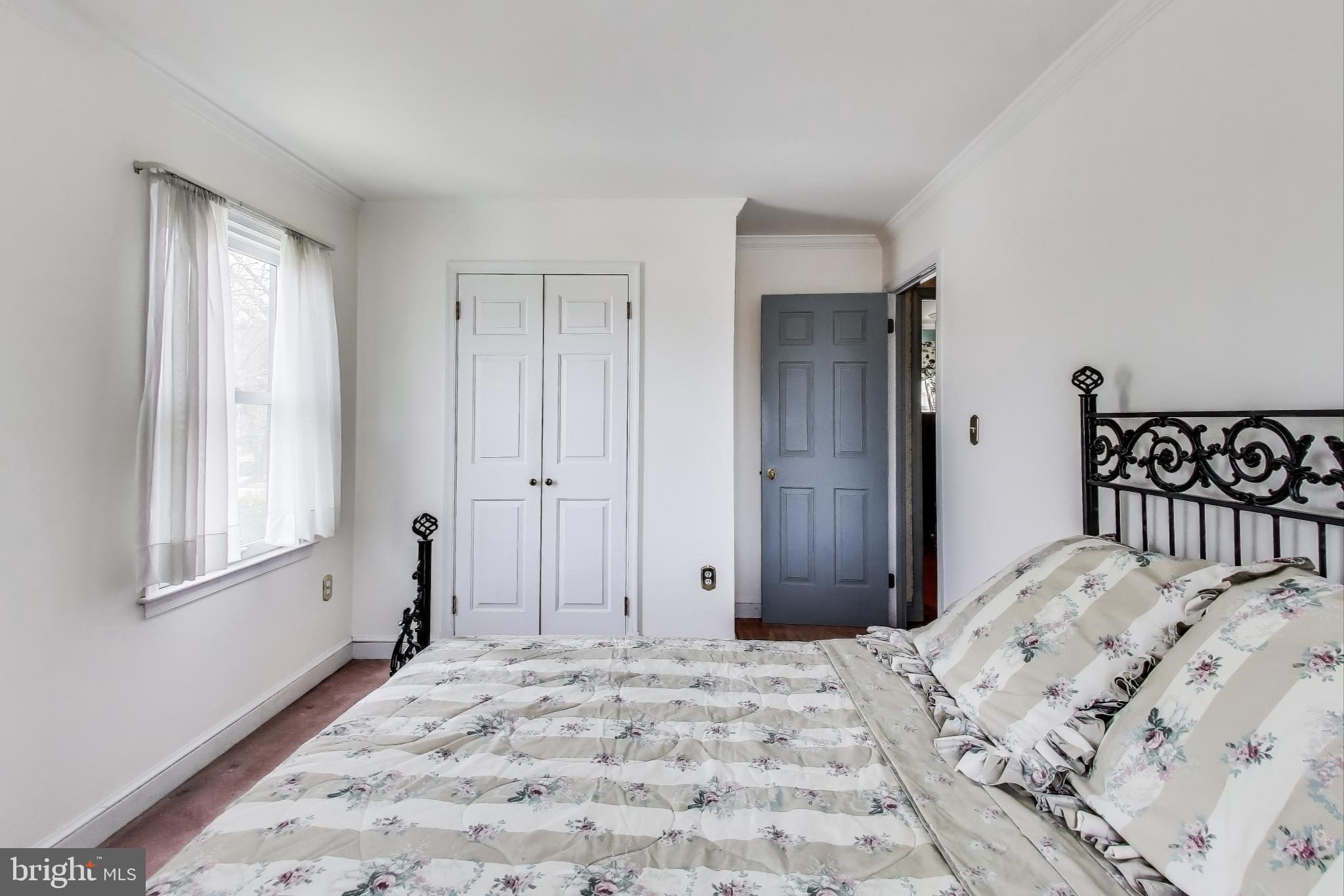 9201 Centerway Road Gaithersburg, MD 20879 - Photo 21 of 53 a bedroom with a bed and a window