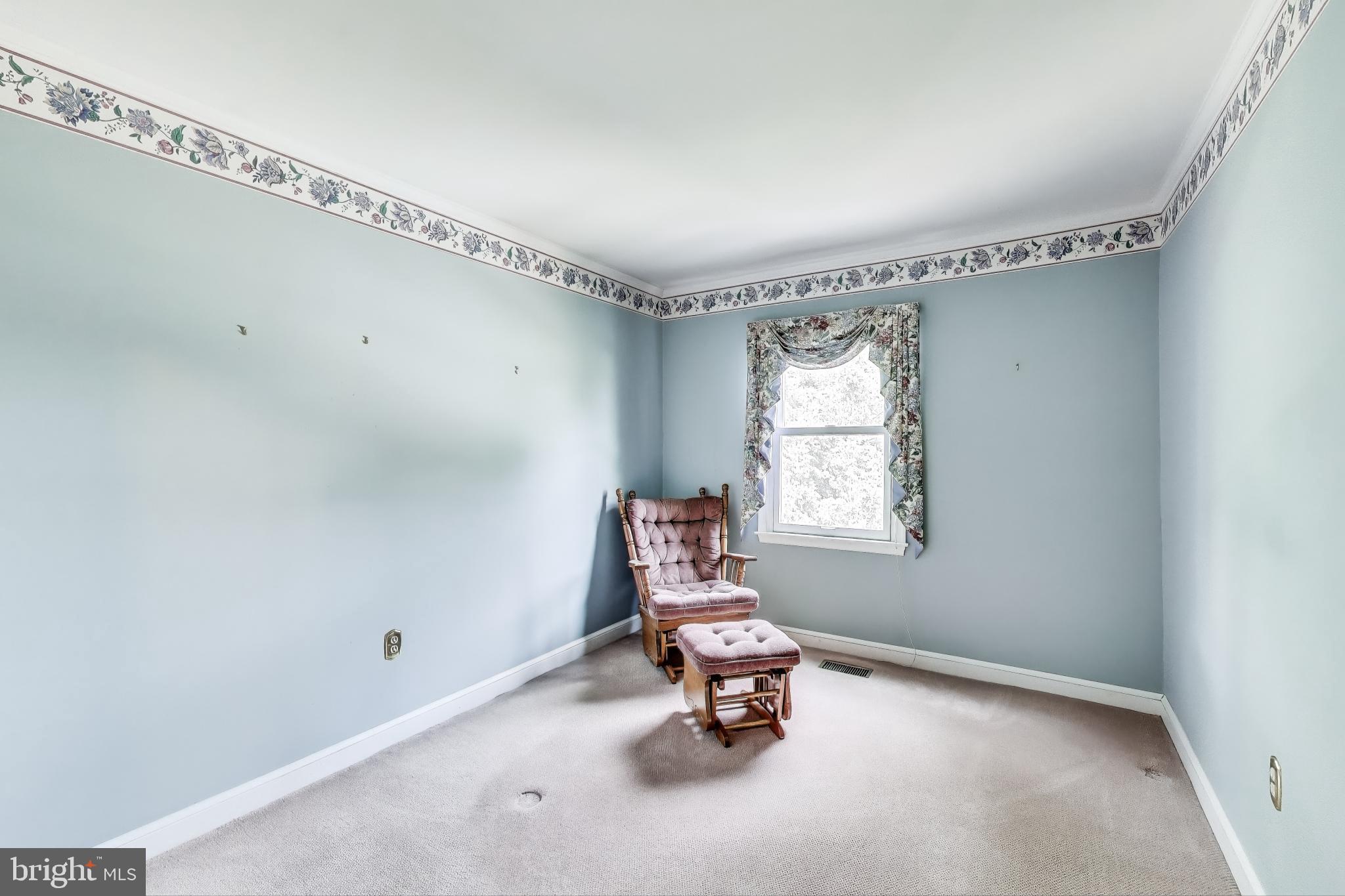 9201 Centerway Road Gaithersburg, MD 20879 - Photo 24 of 53 a living room with a window