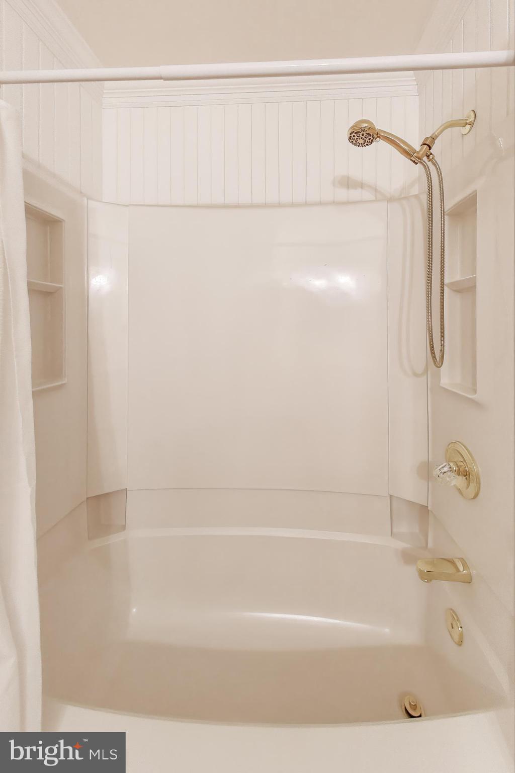 9201 Centerway Road Gaithersburg, MD 20879 - Photo 27 of 53 a bathroom with a shower and a bath tub