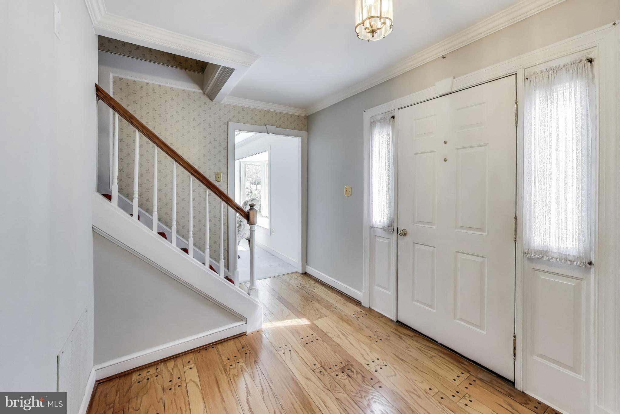 9201 Centerway Road Gaithersburg, MD 20879 - Photo 3 of 53 a view of an entryway with wooden floor